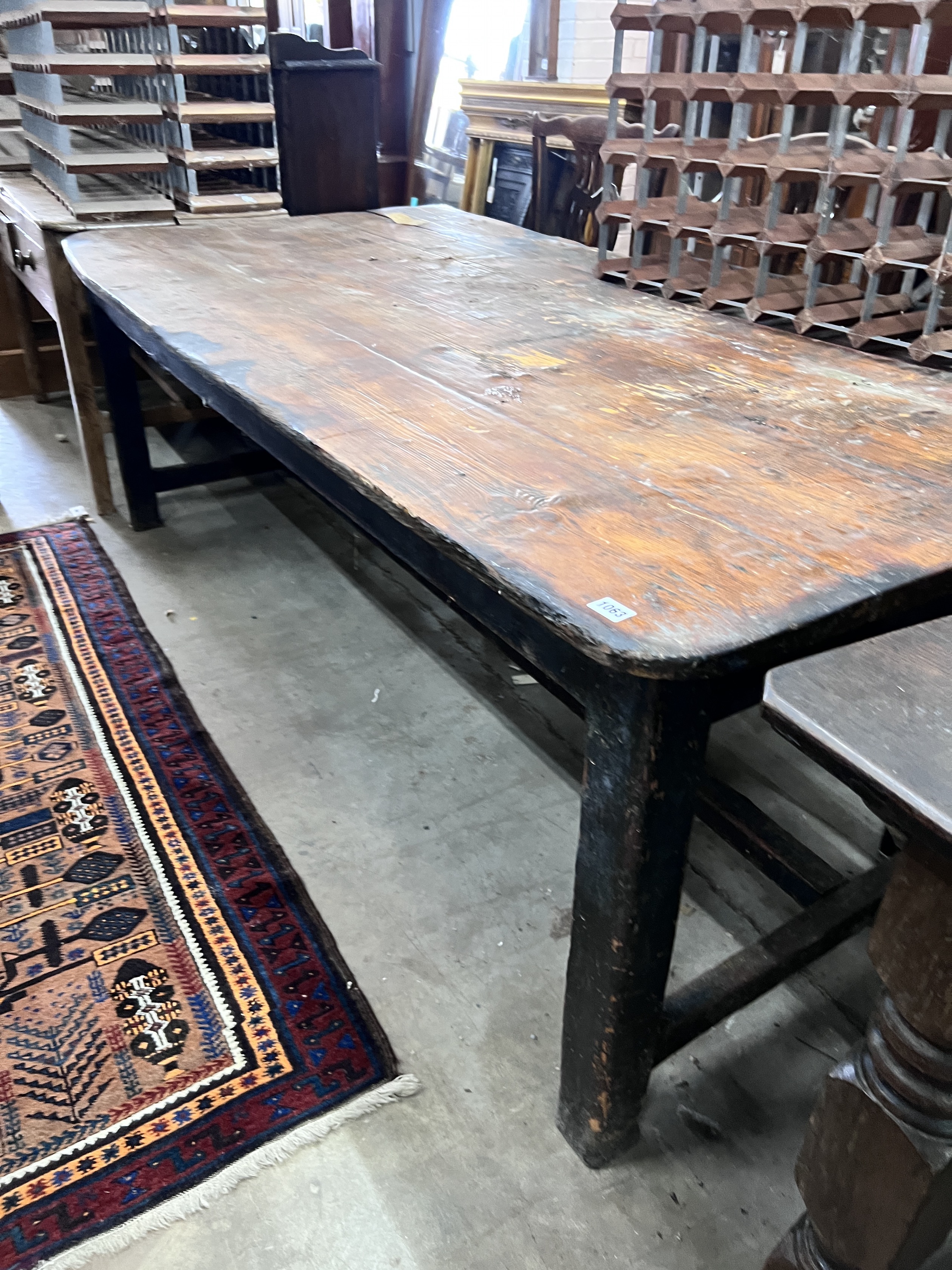 A 19th century rectangular pine planked top kitchen table, length 206cm, width 102cm, height 71cm